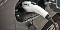 Detail Of An Electric Car Being Charged On The Street